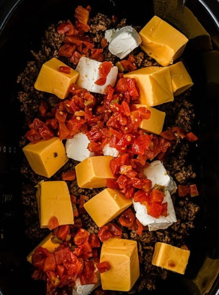 Homemade Rotel Dip served in a bowl, ready for dipping with tortilla chips.